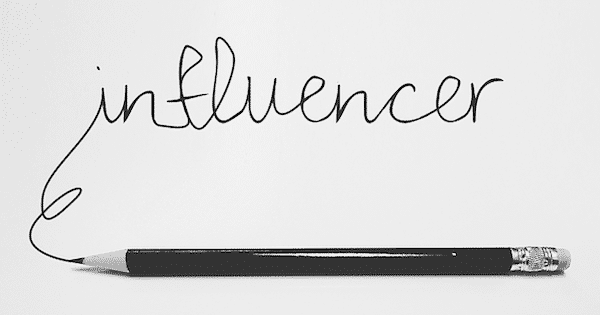 product review influencer written in pencil on a white piece of paper.