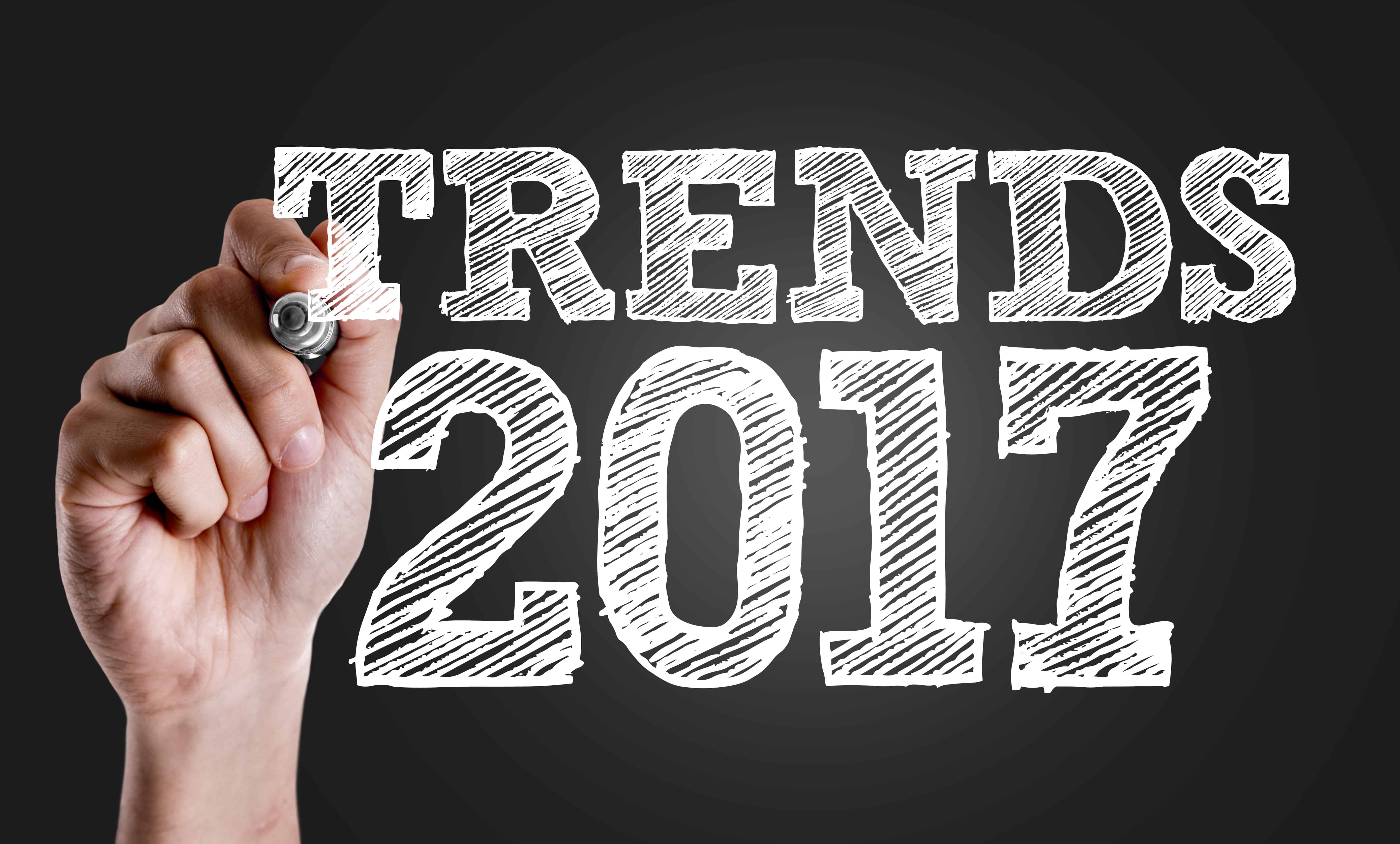 Hand writing the text: Trends 2017