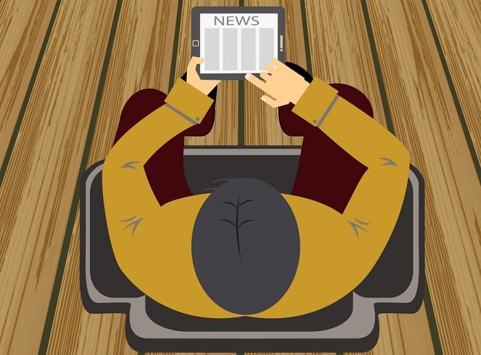 Man Reading Newspaper from tablet