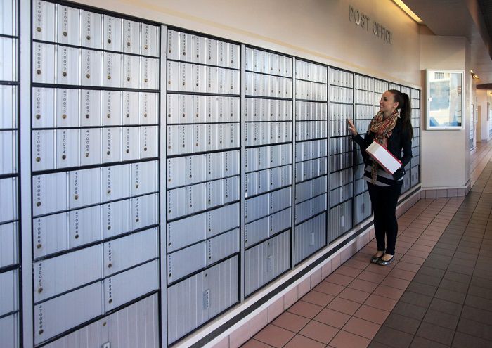 woman looking at po boxes