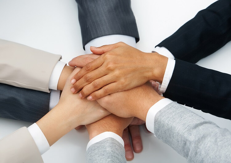 strategic alliance pile of hands