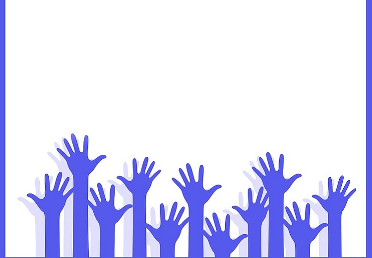Volunteering hands stretched above