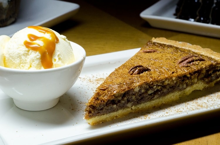 Pecan pie and ice cream on a plate