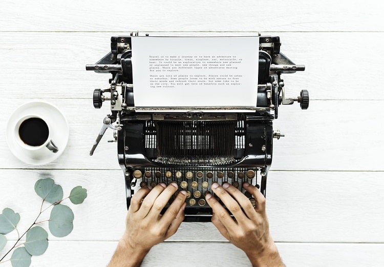 Freelance writer using a typewriter