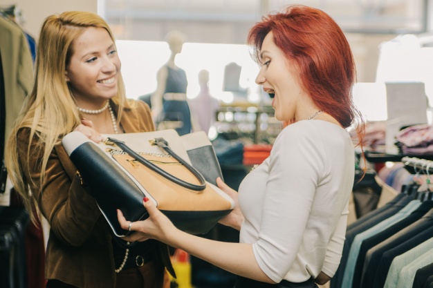 marketing plan - women buying a new bag