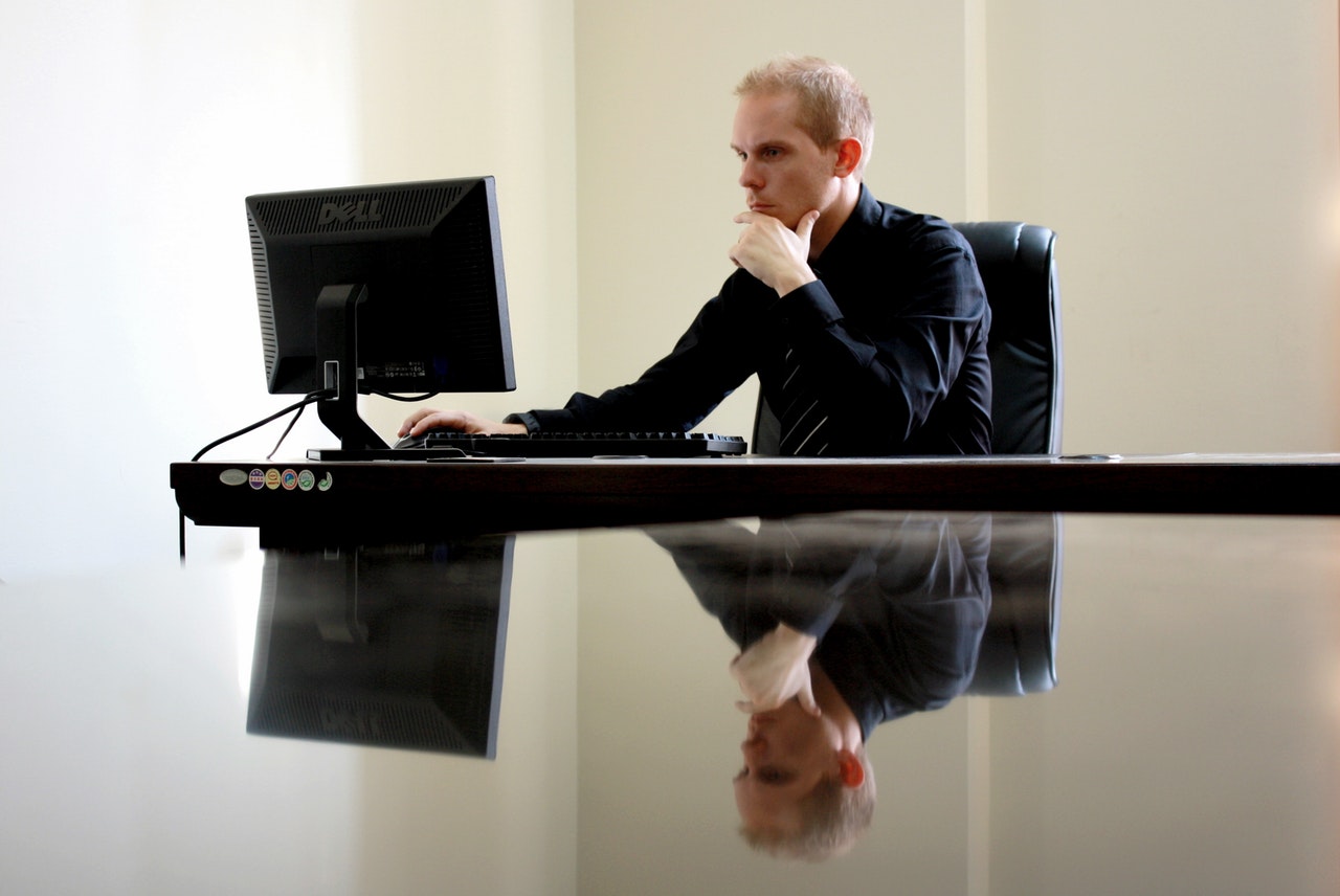 Man sitting and facing the monitor